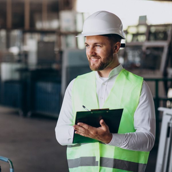 Young man engineer working on factory